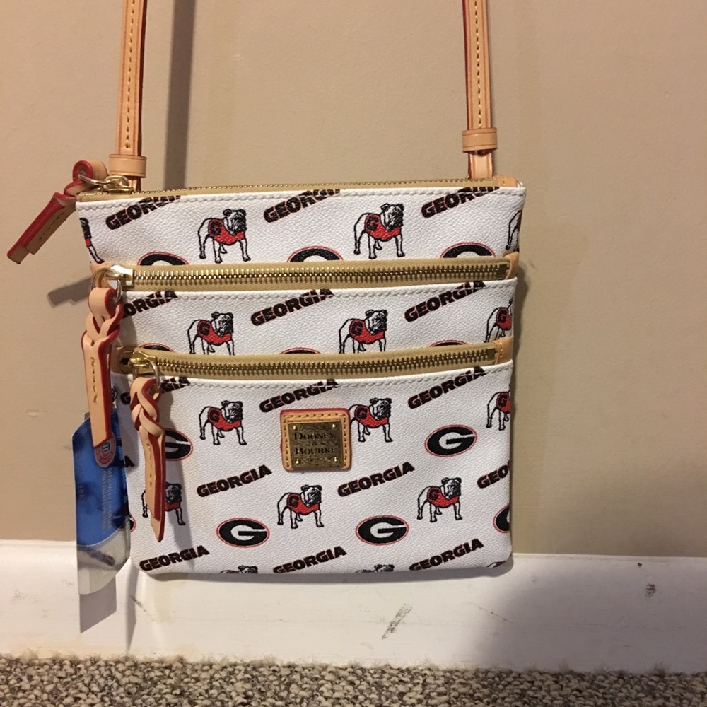 Dooney & Bourke adjustable cross body bag.